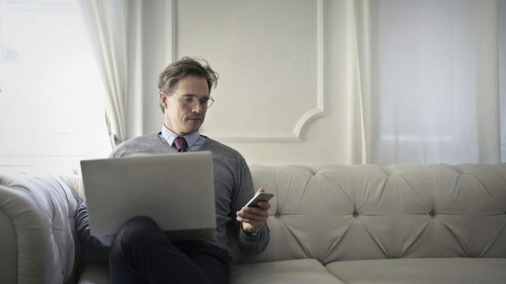 a man holding a leptop