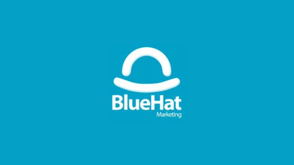 Logo of BlueHat Marketing featuring a stylized white hat icon above the text “BlueHat Marketing” in bold white font, all set against a bright blue background. Represents a Canadian digital marketing and SEO agency.