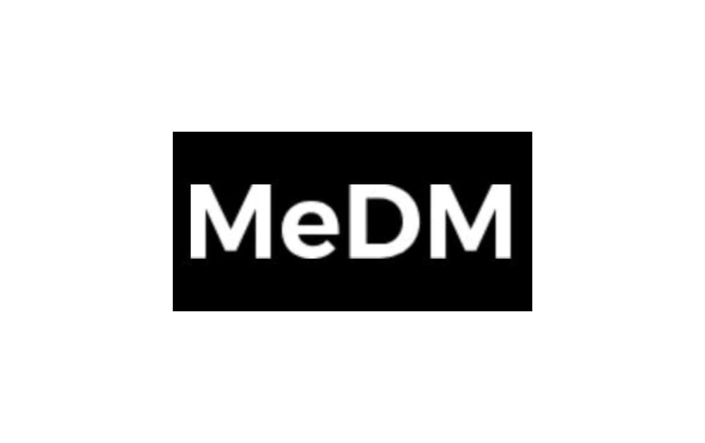 Logo of MeDM with the brand name in bold white text on a solid black rectangular background.