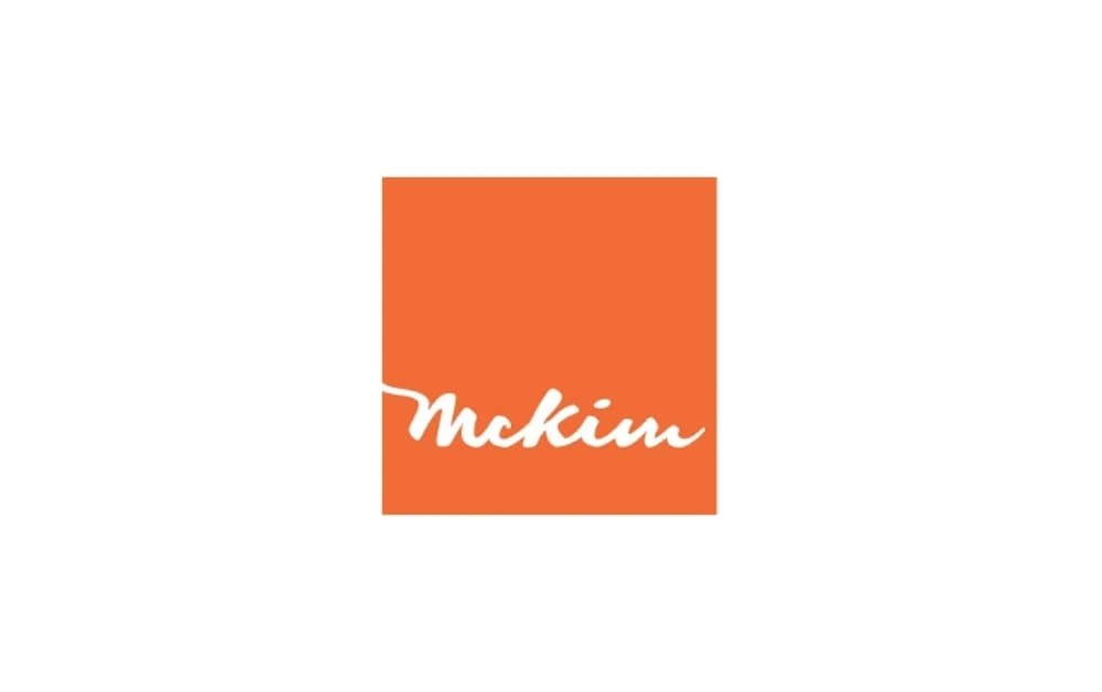 Simple orange square with the handwritten-style white text “McKim” across it, giving a clean and professional appearance.