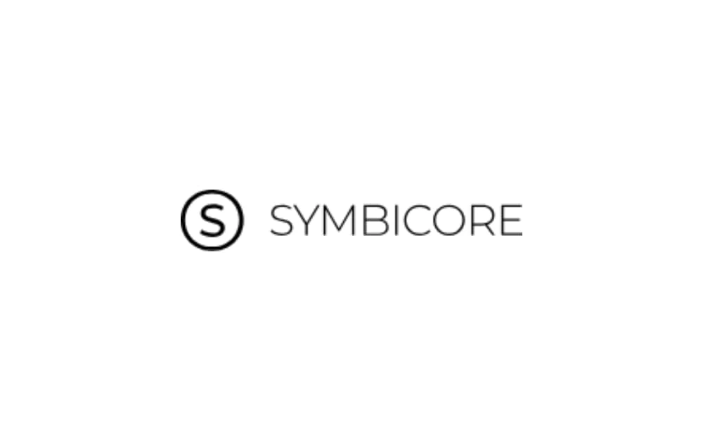 Black and white logo with a bold letter "S" inside a circle, followed by the word "SYMBICORE" in uppercase, clean sans-serif font.