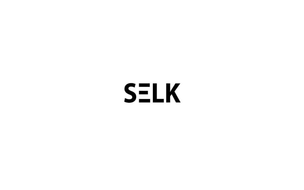 Modern black text logo spelling “SELK” with a unique horizontal bar integrated into the letter “E”, set against a white background.