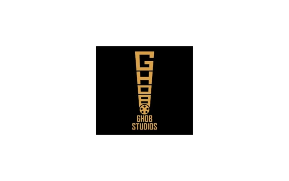 Logo of GHOB Studios featuring a bold vertical yellow exclamation mark with film reel, on a black background.