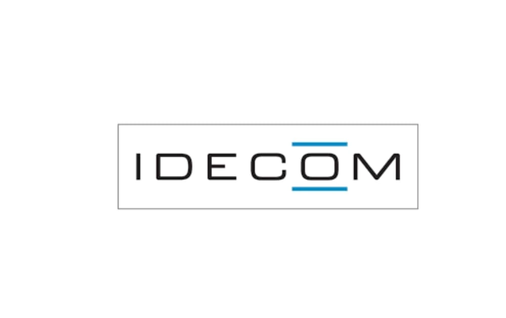 Logo of IDECOM, a marketing and design agency, featuring uppercase typography with blue horizontal bars, conveying clarity and professionalism.