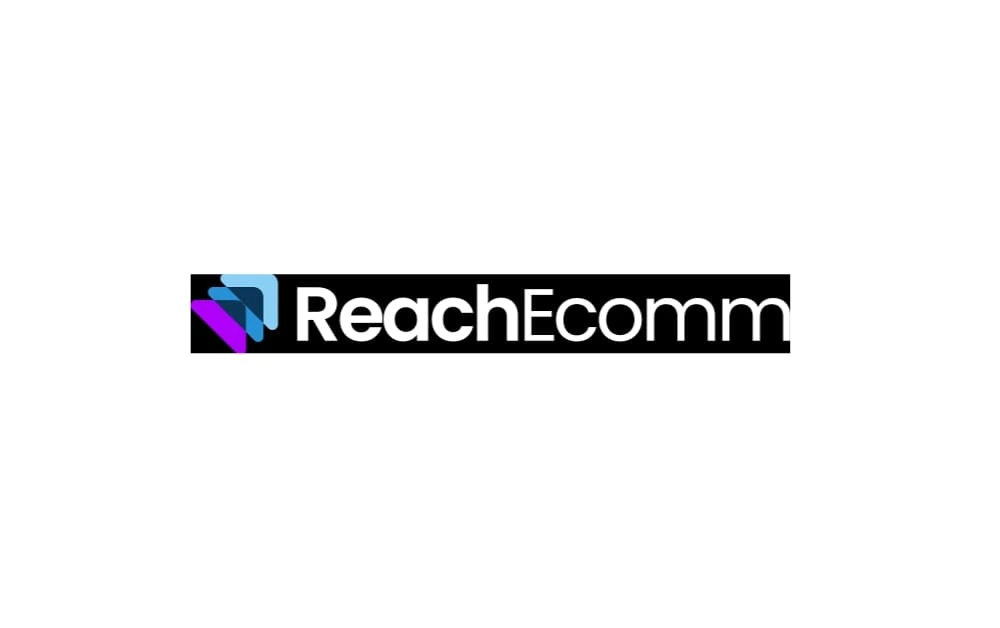 Logo of Reach Ecomm with a black background and modern geometric icon on the left in purple, blue, and cyan shades, followed by white text “ReachEcomm.”