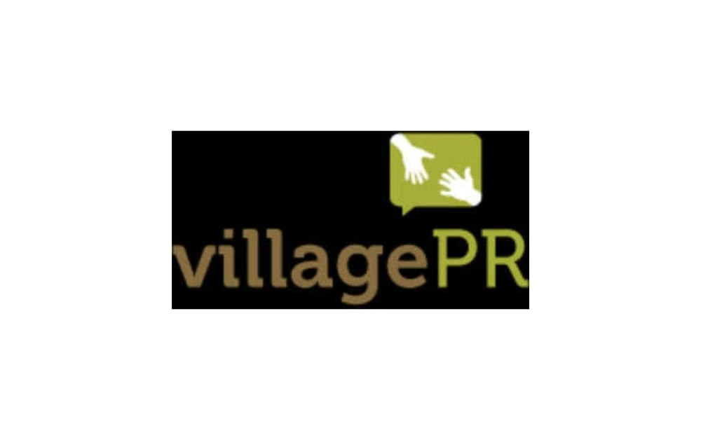 Village PR logo with brown and green text, featuring two white hands reaching inside a green speech bubble.